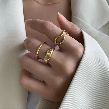 Малко дизайнерско усещане за комбинирано пръстен за костюми-тройки с приливите и отливите, модата и индивидуалност, пръстен на указательном пръста си на студен вятър